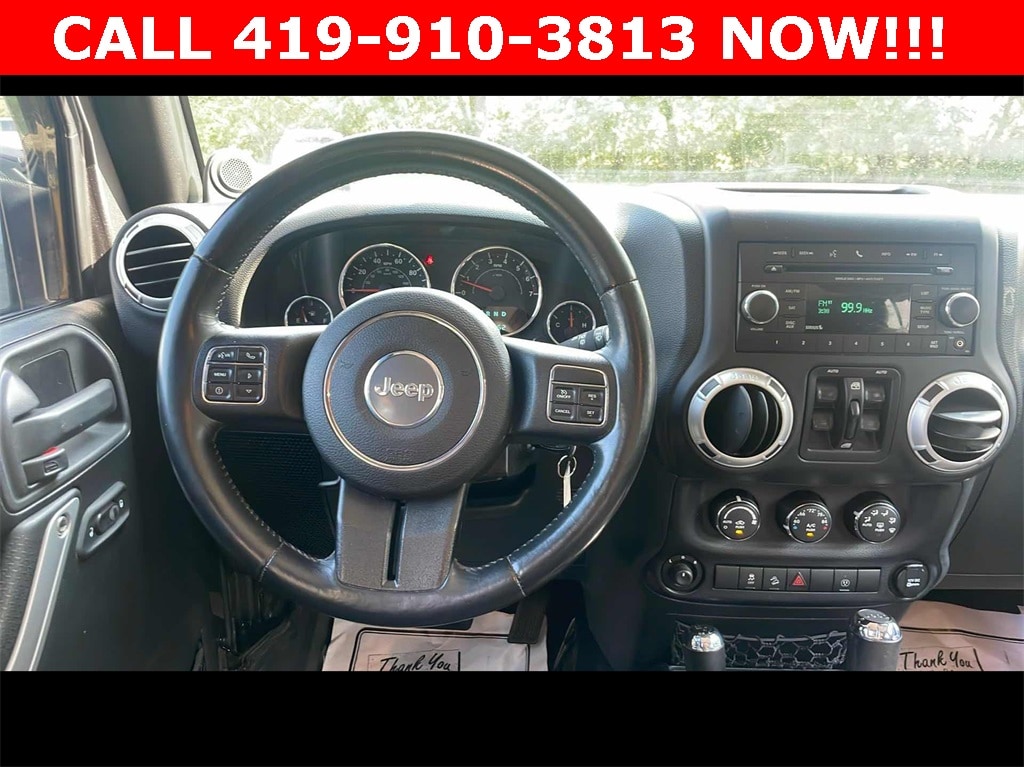 Used 2014 Jeep Wrangler Unlimited Sahara with VIN 1C4BJWEG0EL167818 for sale in Fremont, OH