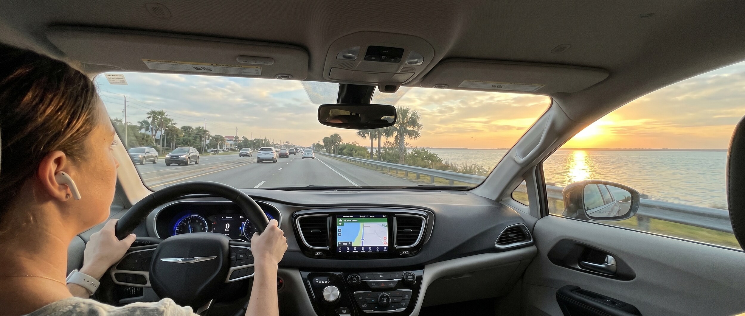 Driver using Uconnect system in Ram 1500 during Panama City FL commute