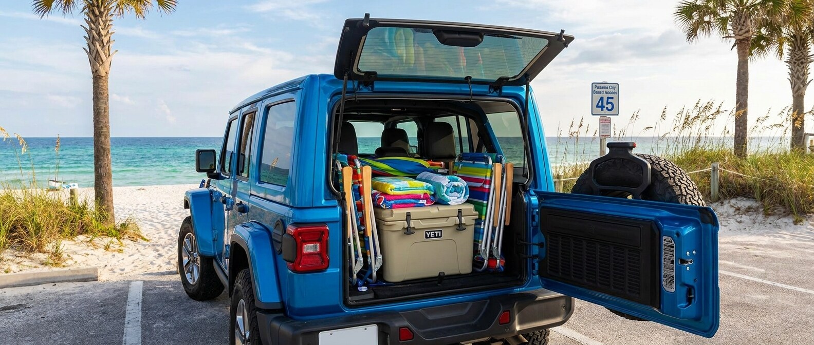 2026 Jeep Wrangler Unlimited loaded with beach gear in a Panama City Beach parking lot on Labor Day weekend