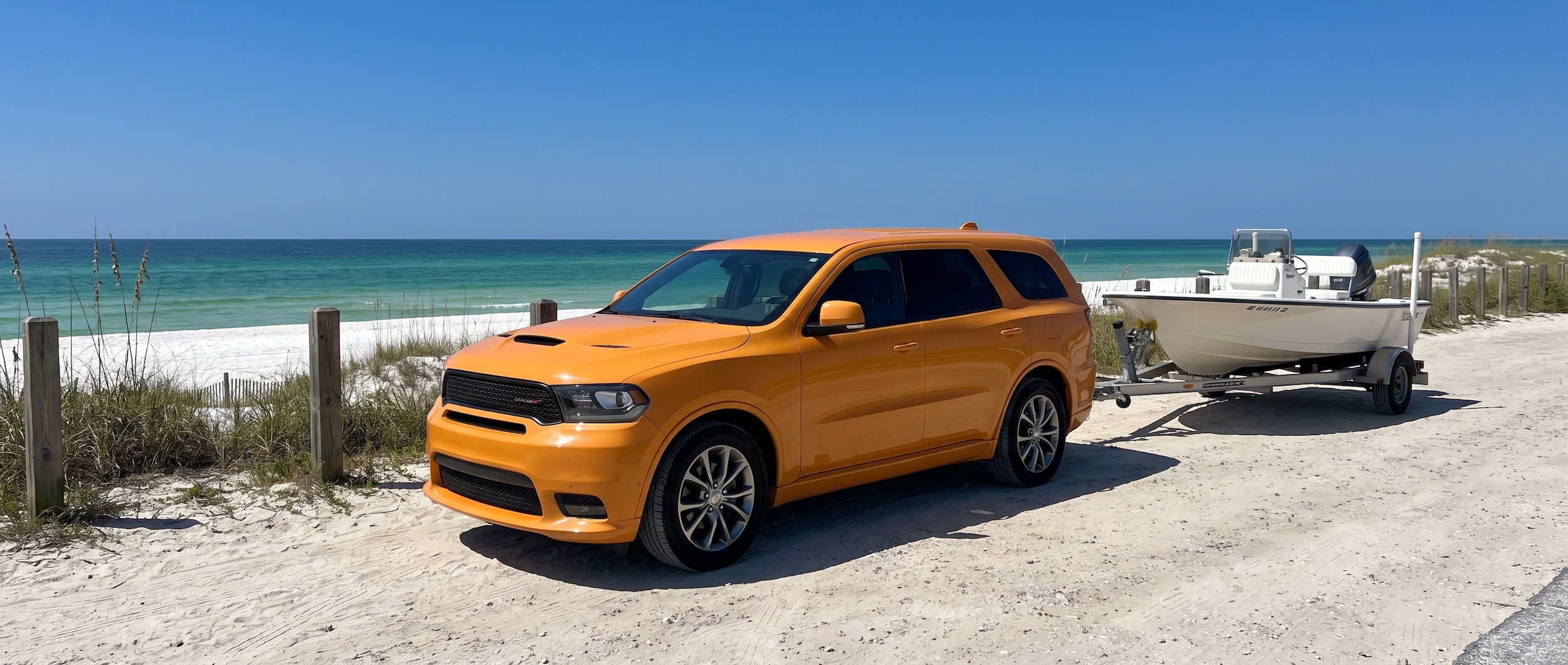2026 Dodge Durango with boat trailer at a Panama City Beach Gulf Coast access point on a sunny summer day