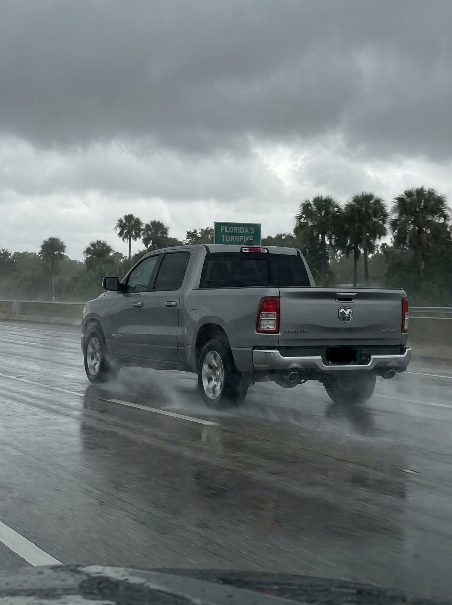 2026 Ram 1500 on wet Florida highway in summer rainstorm