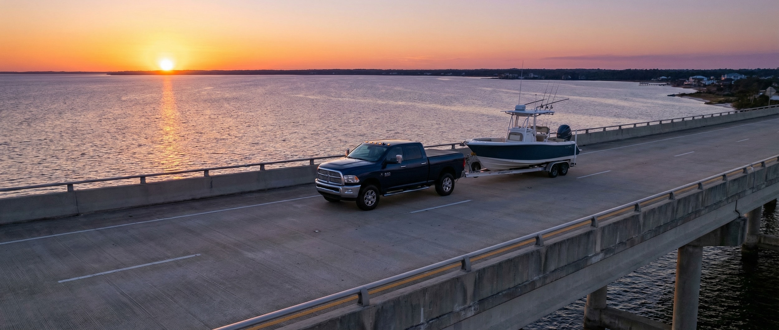 Ram 2500 towing boat across Hathaway Bridge in Birmingham, AL