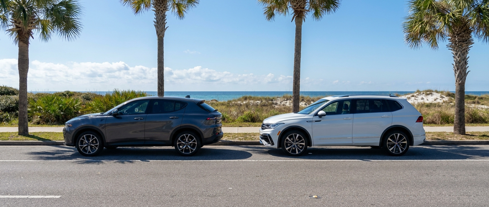 2025 Dodge Hornet and 2026 Volkswagen Tiguan parked side by side on a Panama City, FL coastal road