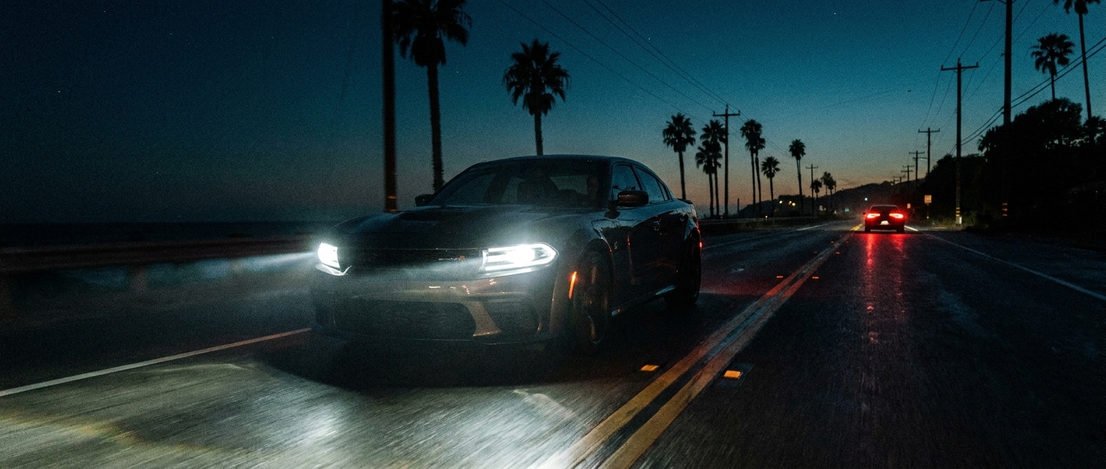 2026 Dodge Charger Scat Pack LED headlights illuminating a night highway near Panama City, FL