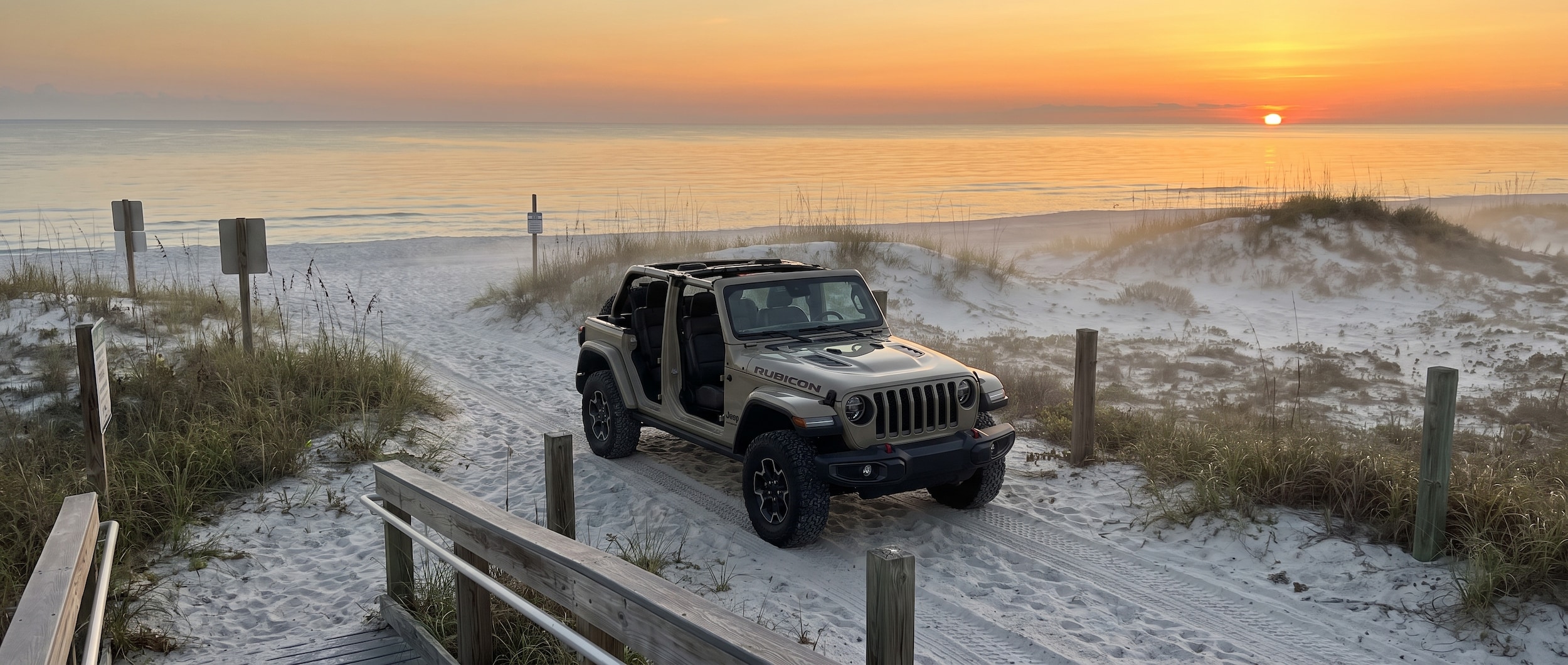2026 Jeep Wrangler at a Gulf Coast sunrise beach access point near Panama City, FL