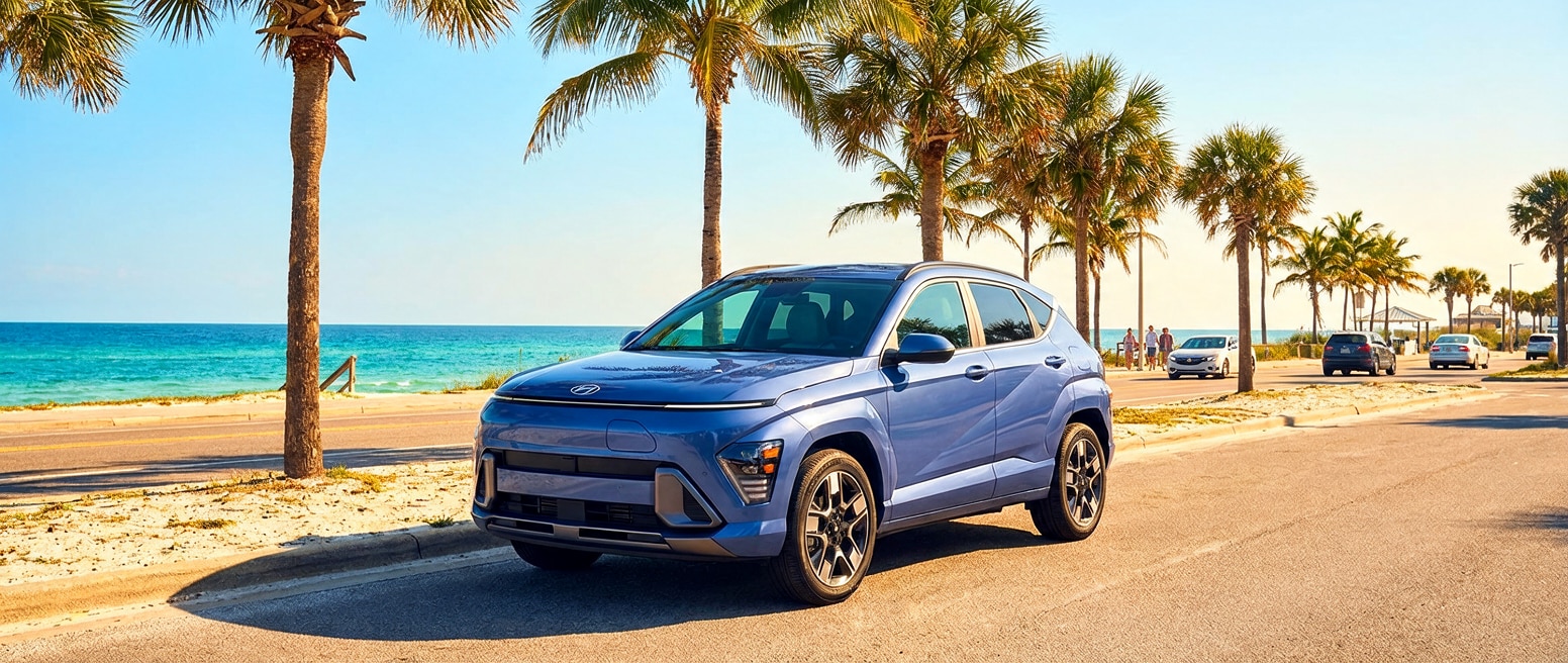 2025 Hyundai Kona Electric parked on a sunny Panama City, FL street with palm trees