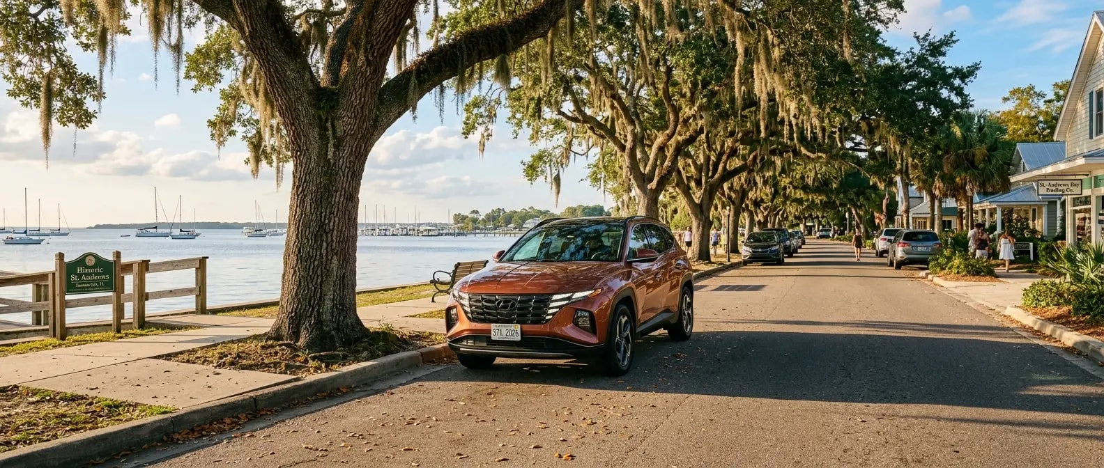 2026 Hyundai Tucson Hybrid parked on a shaded street near Oaks by the Bay Park in Historic St. Andrews, Panama City, FL
