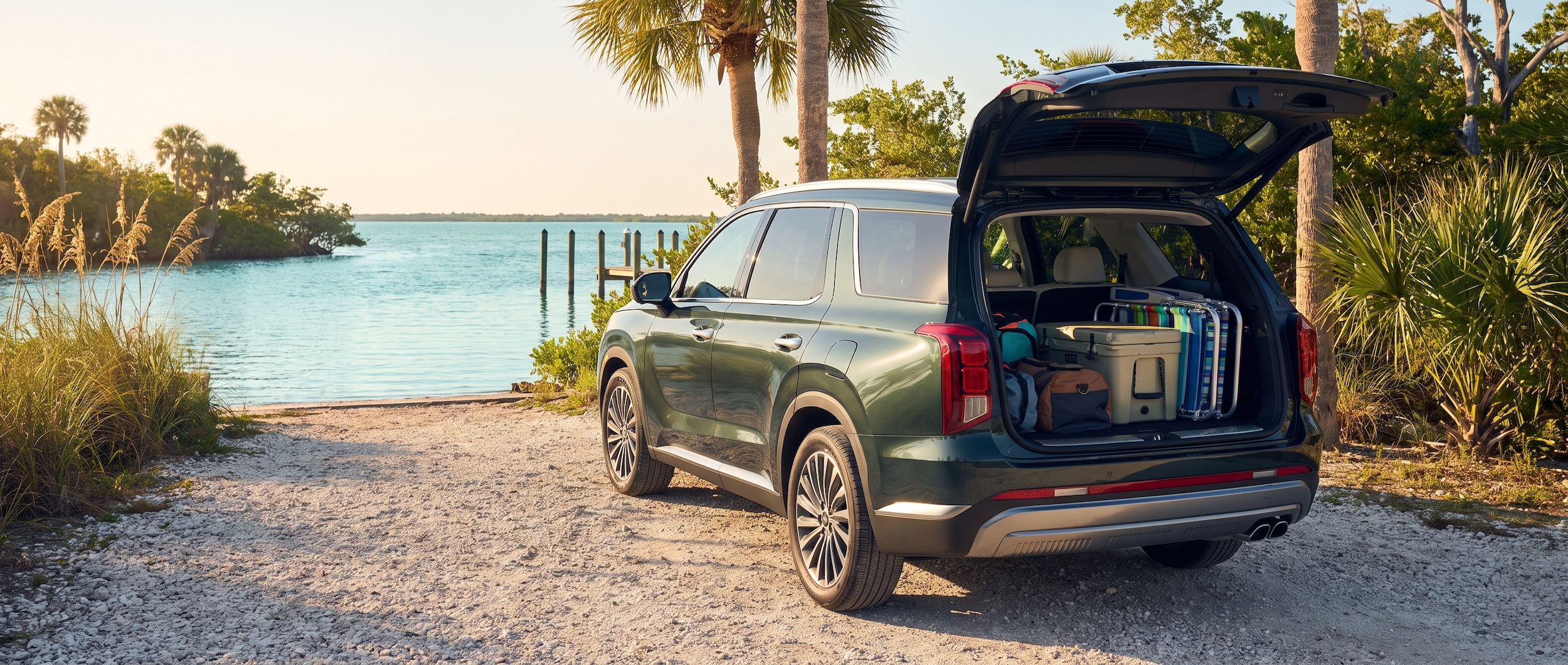 2026 Hyundai Palisade with liftgate open and beach gear loaded near a Gulf Coast waterfront in Panama City, FL