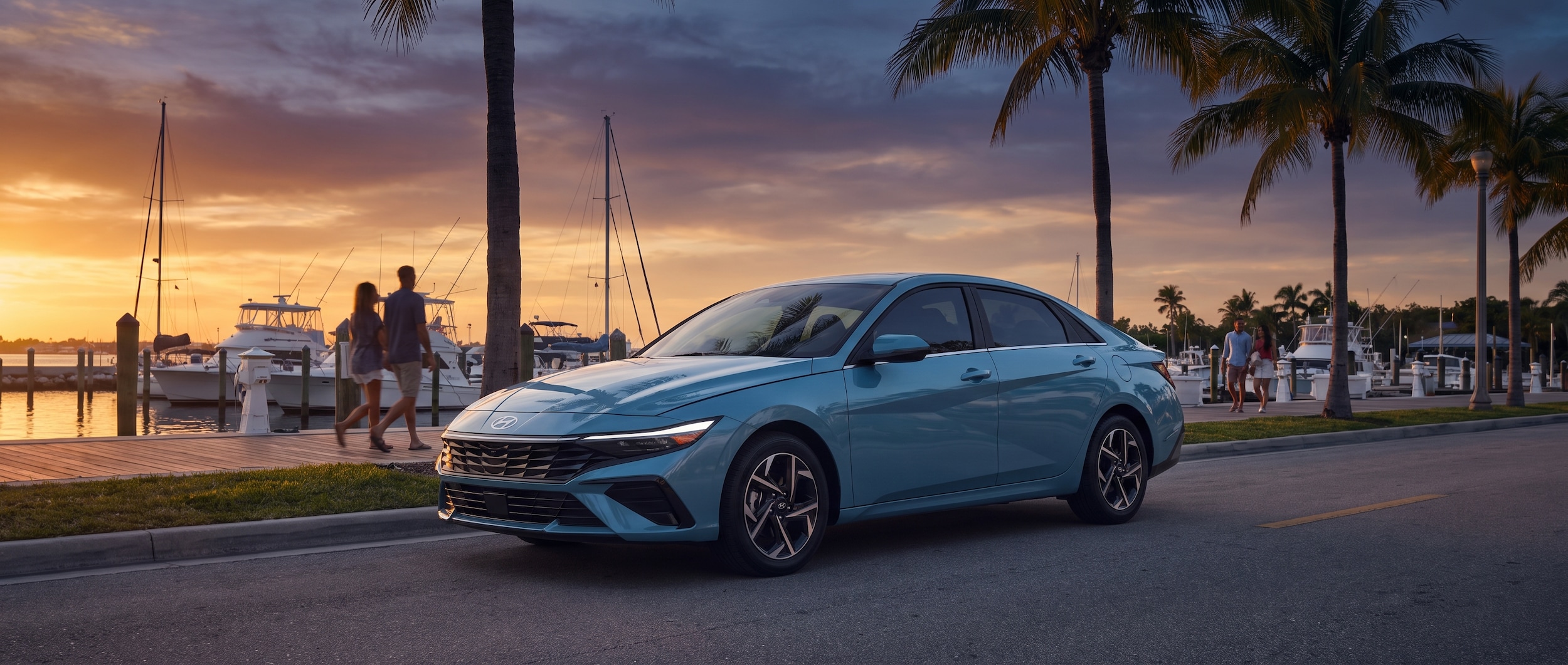A 2026 Hyundai Elantra in coastal-blue or silver, parked neatly along a waterfront street at dusk near a Florida marina, palm trees and warm evening light in the background, no other vehicles crowding the frame.