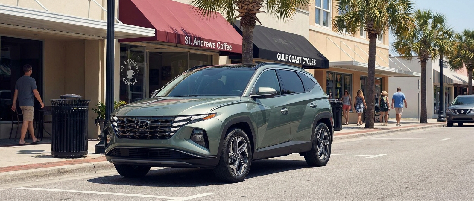 2026 Hyundai Tucson Hybrid on a Panama City FL urban street with palm trees and storefronts