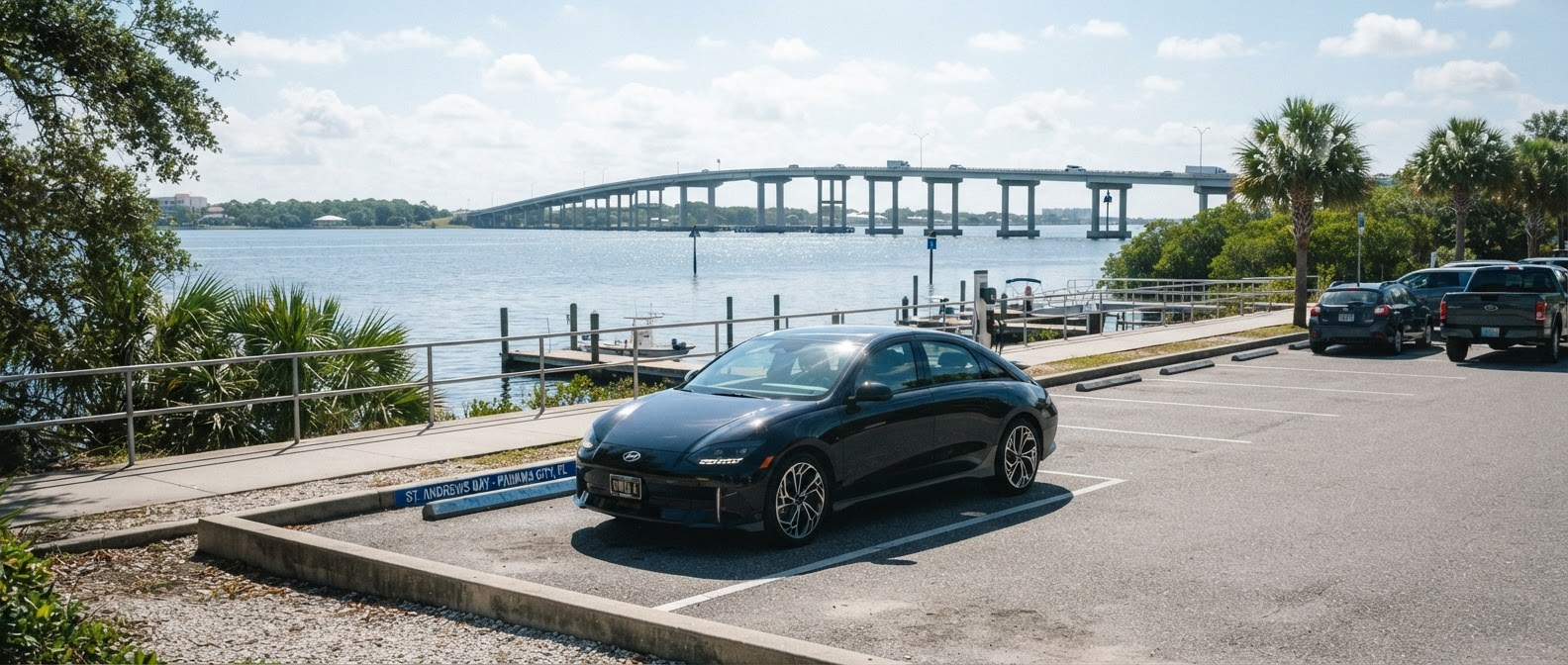 2025 Hyundai IONIQ 6 near St. Andrews Bay with Hathaway Bridge in the background, Panama City, FL
