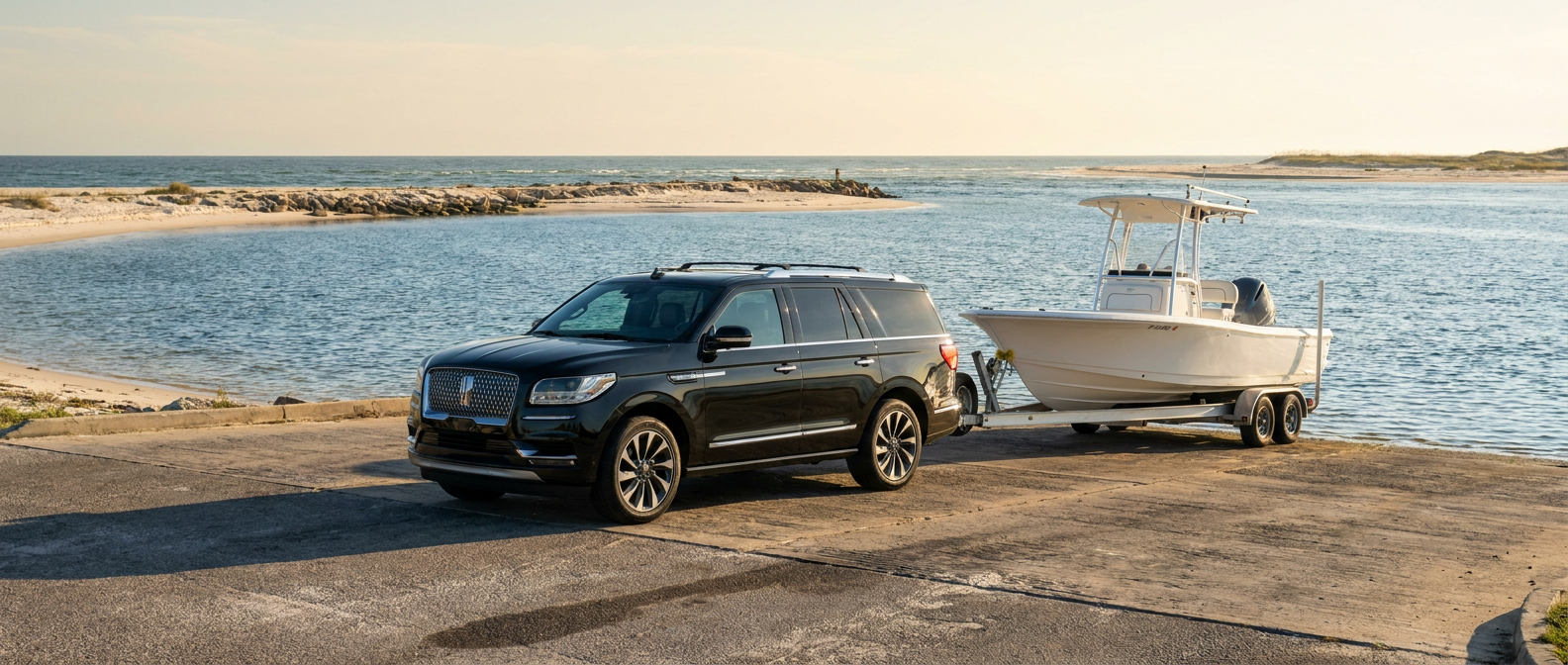2026 Lincoln Navigator towing a boat at a Grand Lagoon boat ramp near Panama City, FL