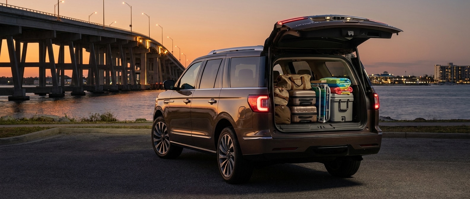 2027 Lincoln Navigator L with rear liftgate open near the Hathaway Bridge in Panama City, FL