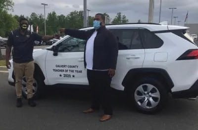 2-people-in-front-of-white-SUV.jpeg