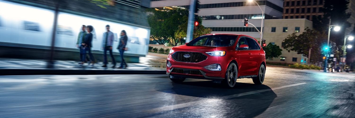 Blue Ford Edge driving