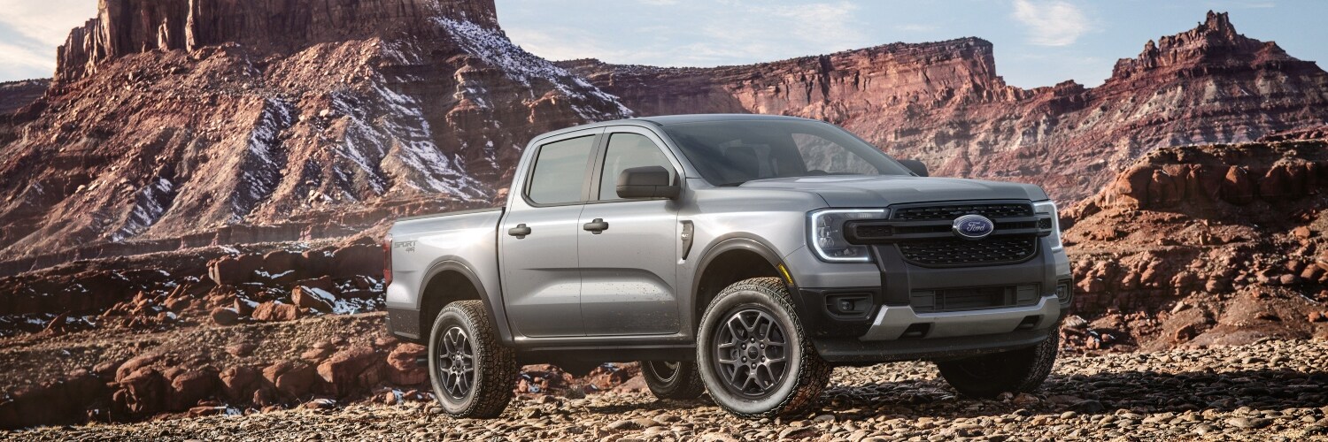 Ford Ranger parked next to mountains