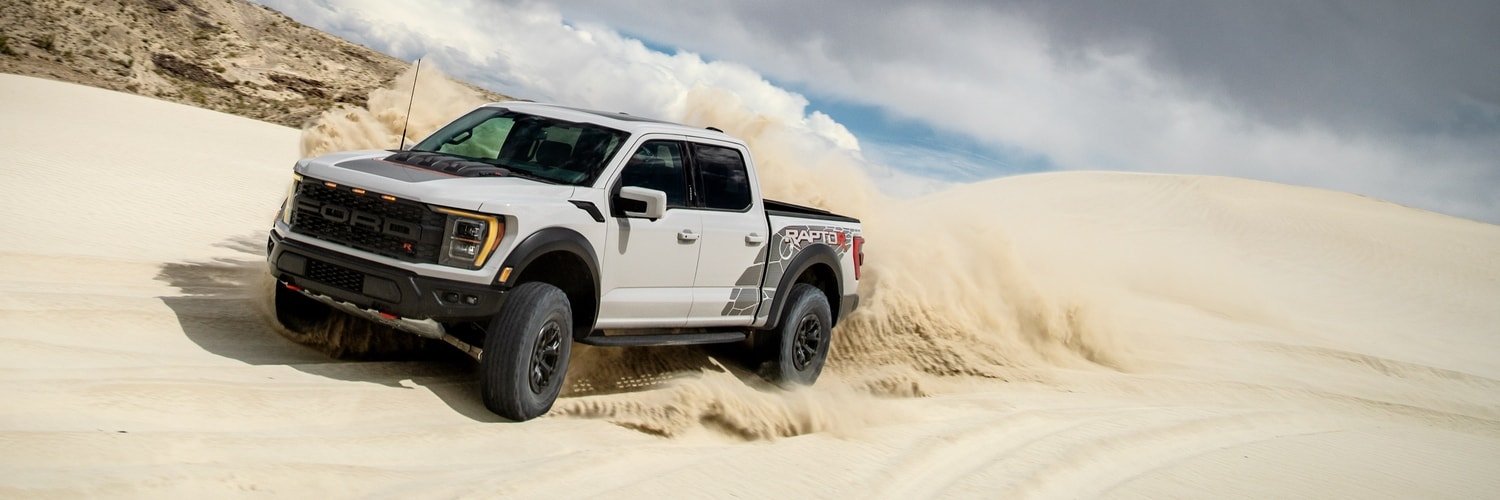 Ford Raptor F150 Truck driving in dunes