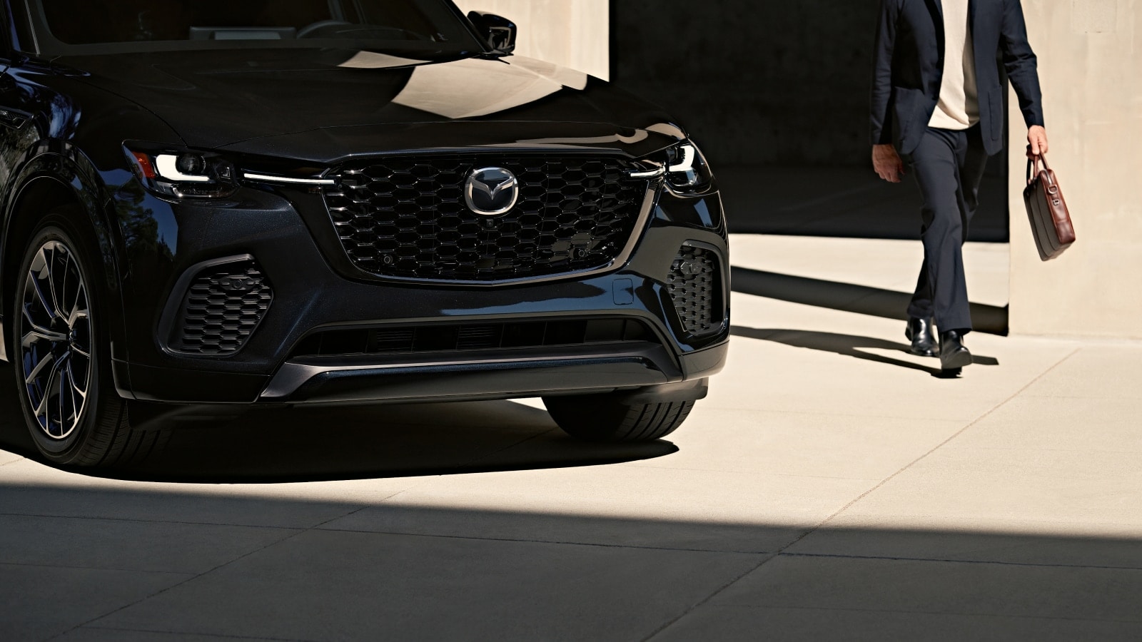 Front view of black Mazda CX-70 SUV.