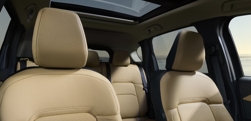  2026 Mazda CX-5 interior with beige leather seating.