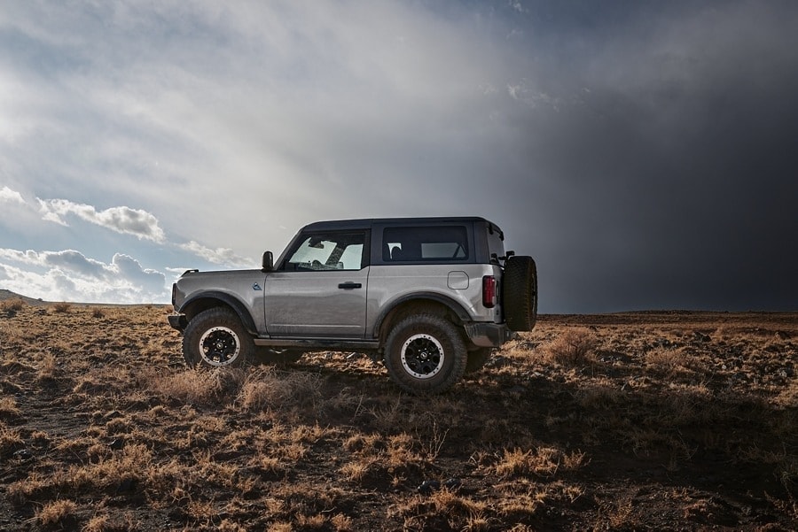 Silver Ford Bronco Off Roading in a Desert.jpg