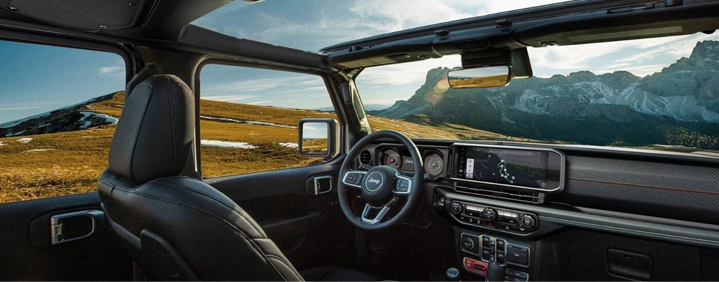 The black interior of a 2025 Jeep Wrangler.