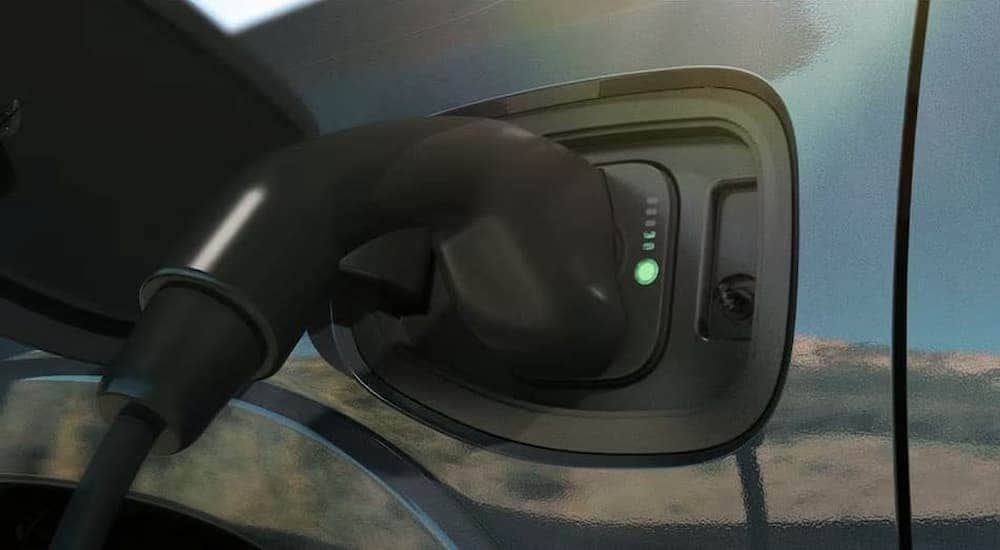 A close-up on the smart charging port of a 2025 Ram 1500 Ramcharger.