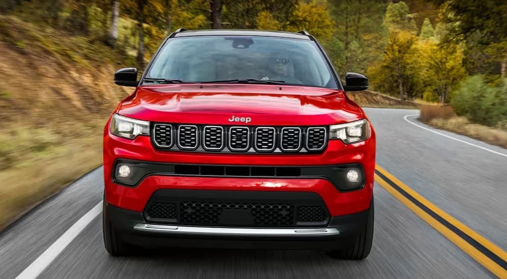 Jeep%20Compass%20for%20sale%20-%202025%20Jeep%20Compass%20Limited%20-%20Red%20Highway.jpg A red 2025 Jeep Compass Limited is shown driving on a highway.