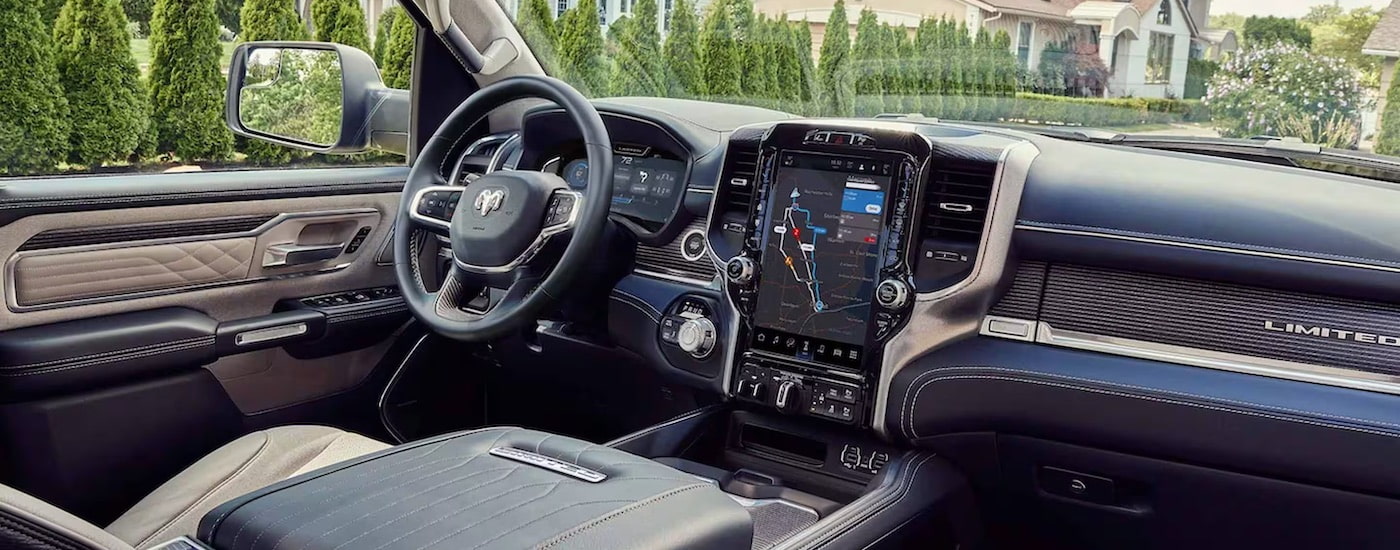 The interior of a 2024 Ram 1500 Limited is shown from the passenger side.
