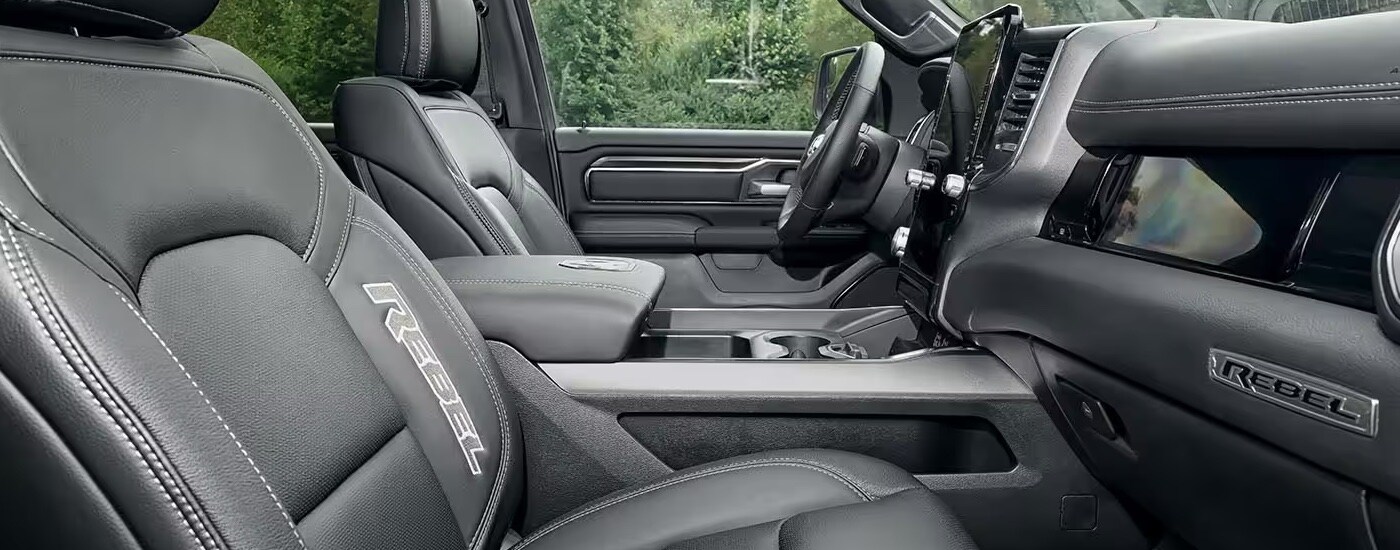 Side view of the cabin of a 2025 Ram 1500 Rebel with grey upholstery.