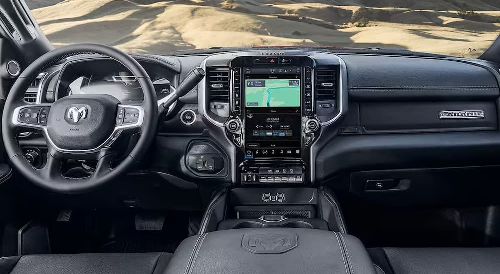The black dashboard is shown in a 2025 Ram 2500 Laramie.