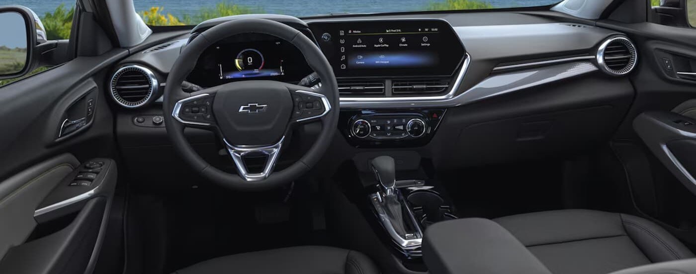 The black interior and dash are shown in a 2025 Chevy Trax for sale near Greenfield.