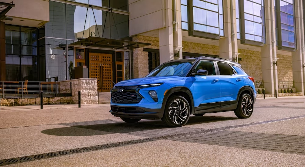 A blue 2024 Chevy Trailblazer RS parked on a city street.