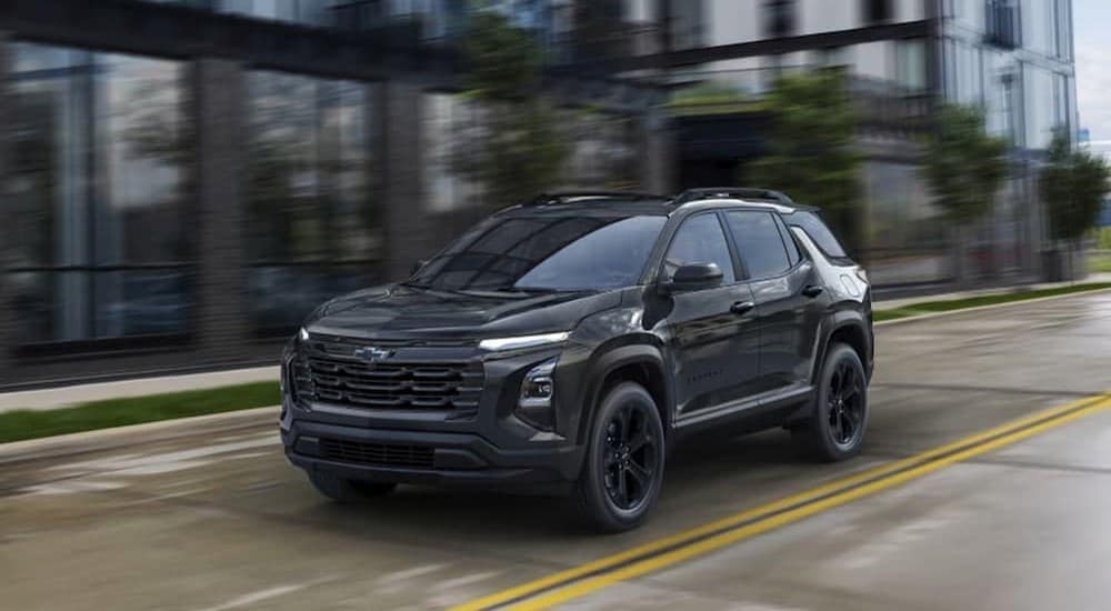 Chevy%20Equinox%20for%20sale%20-%202025%20Chevy%20Equinox%20Midnight%20Edition%20-%20Black.jpg A black 2025 Chevy Equinox Midnight Edition is shown driving on a city street.