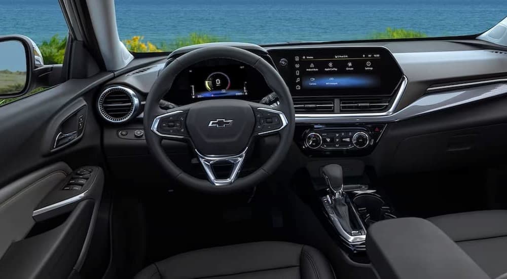 The black interior and dash in a 2024 Chevy Trax is shown.