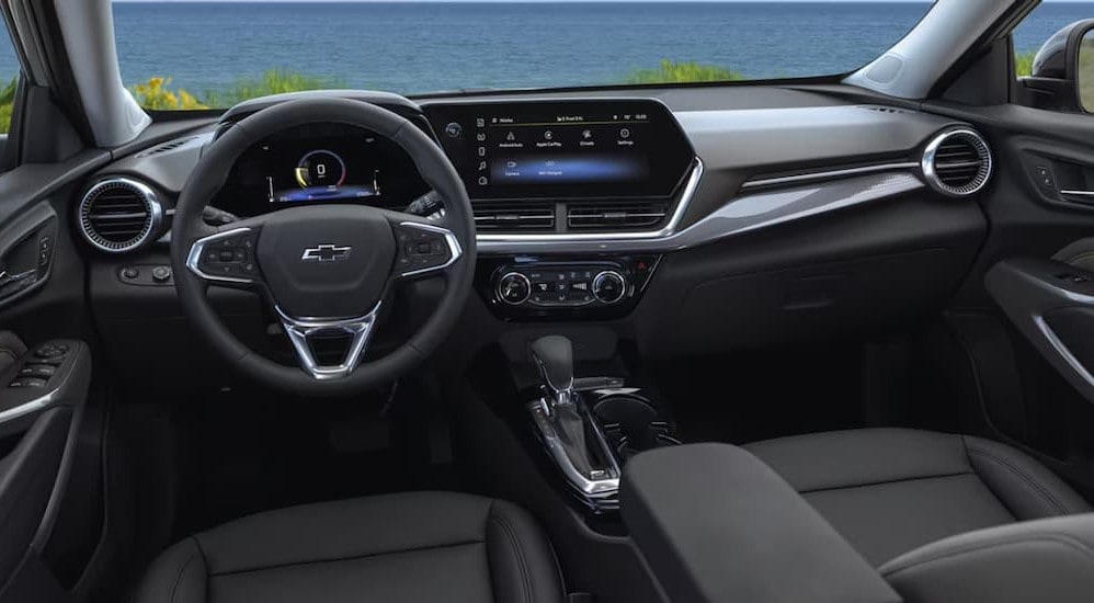 The black interior and dash are shown in a 2025 Chevy Trax for sale.