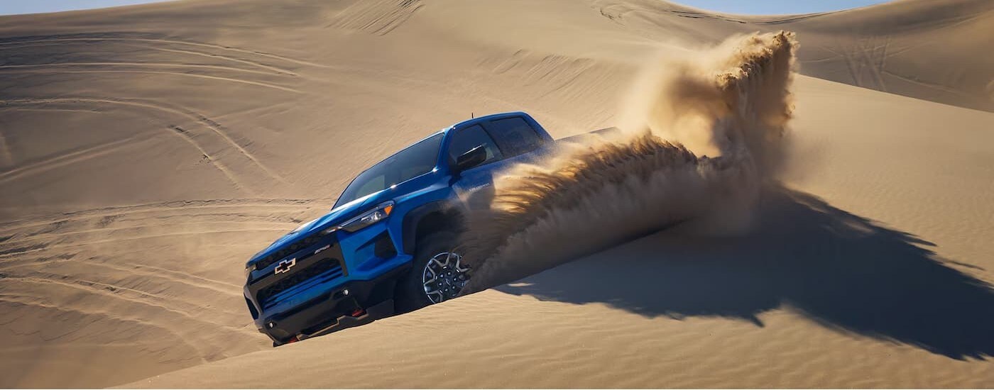 A blue 2025 Chevy Colorado ZR2 off-roading.