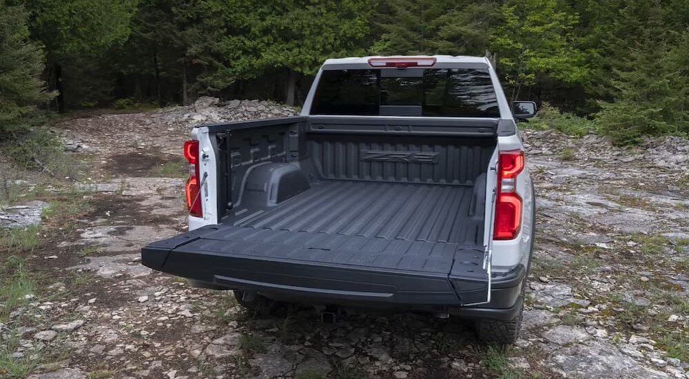 The open tailgate of a white 2024 Chevy Silverado 1500 ZR2.