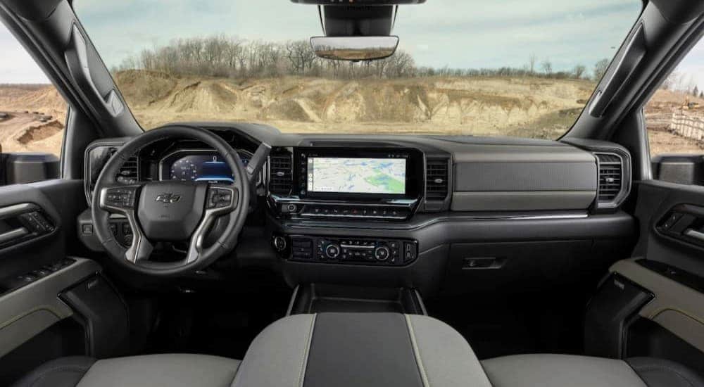 The gray interior and dash in a 2024 Chevy Silverado 1500 ZR2 is shown.
