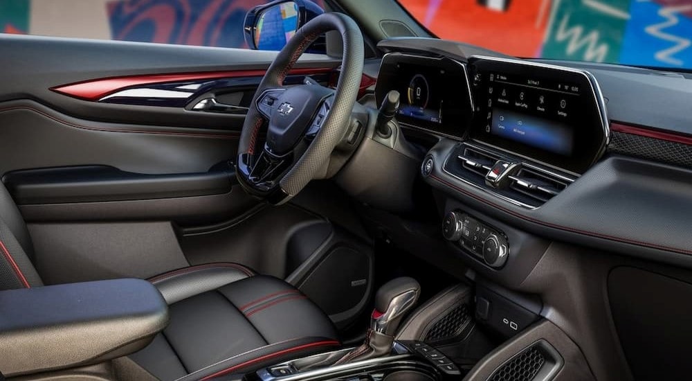 The black and red interior and dash in a 2024 Chevy Trailblazer RS is shown.