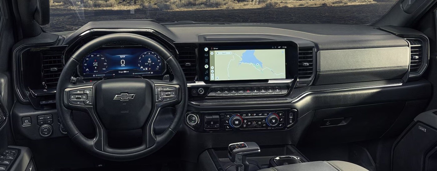 The steering wheel and infotainment screen in a 2024 Chevy Silverado 1500 for sale near Pittsfield.