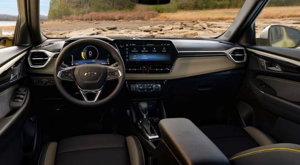 The black interior and dash in a 2025 Chevy Trailblazer for sale is shown.