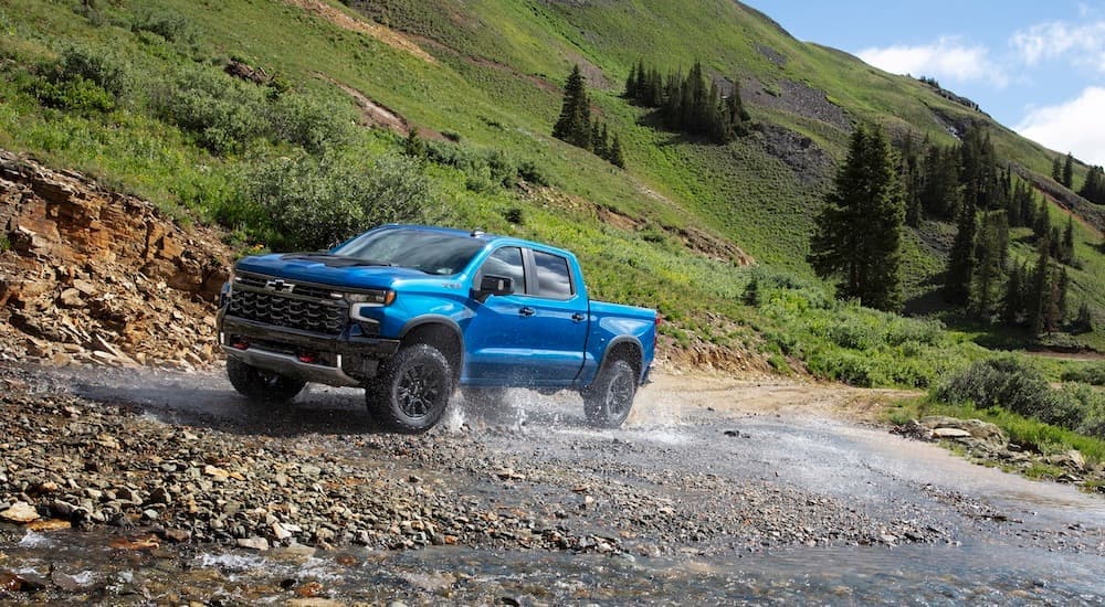 A blue 2024 Chevy Silveradon 1500 ZR2 is shown from the front at an angle after leaving a Chevy dealership near Bennington.