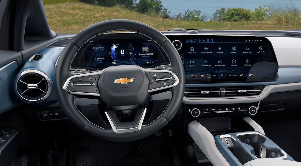 The steering wheel and infotainment screen in a 2024 Chevy Equinox for sale.