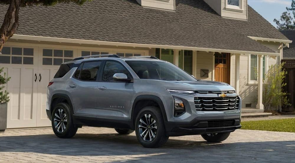 Chevy%20Equinox%20for%20sale%20-%202025%20Chevy%20Equinox%20LT%20-%20Silver.jpg A silver 2025 Chevy Equinox LT is shown parked on a driveway.