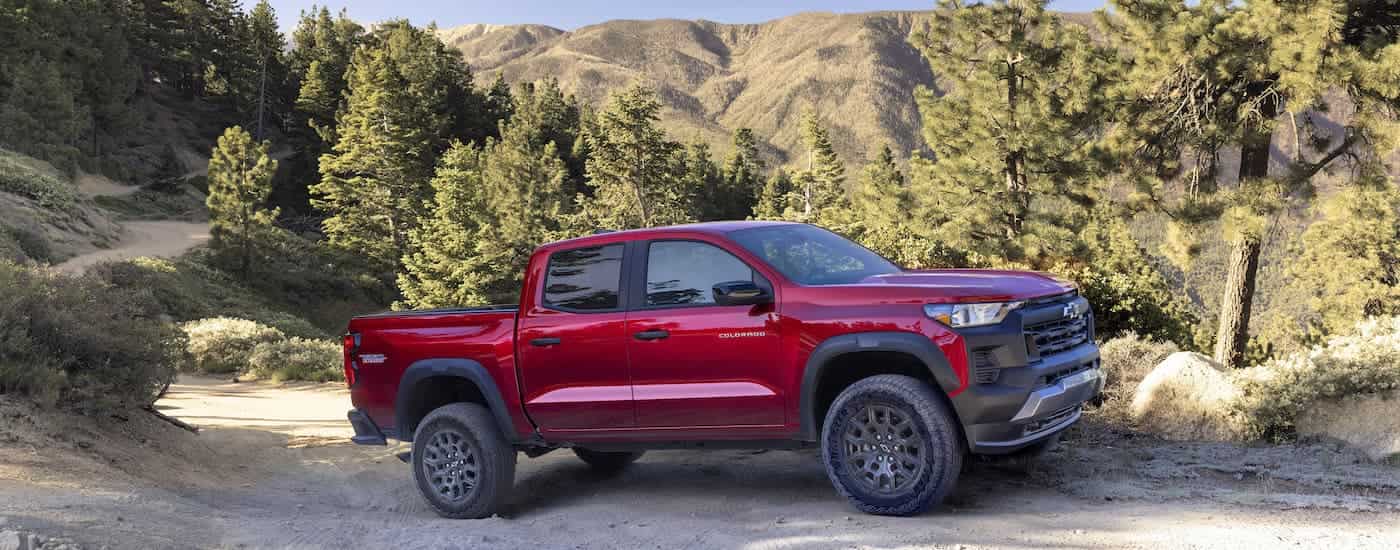 A red 2025 Chevy Colorado for sale near North Adams on a trail.