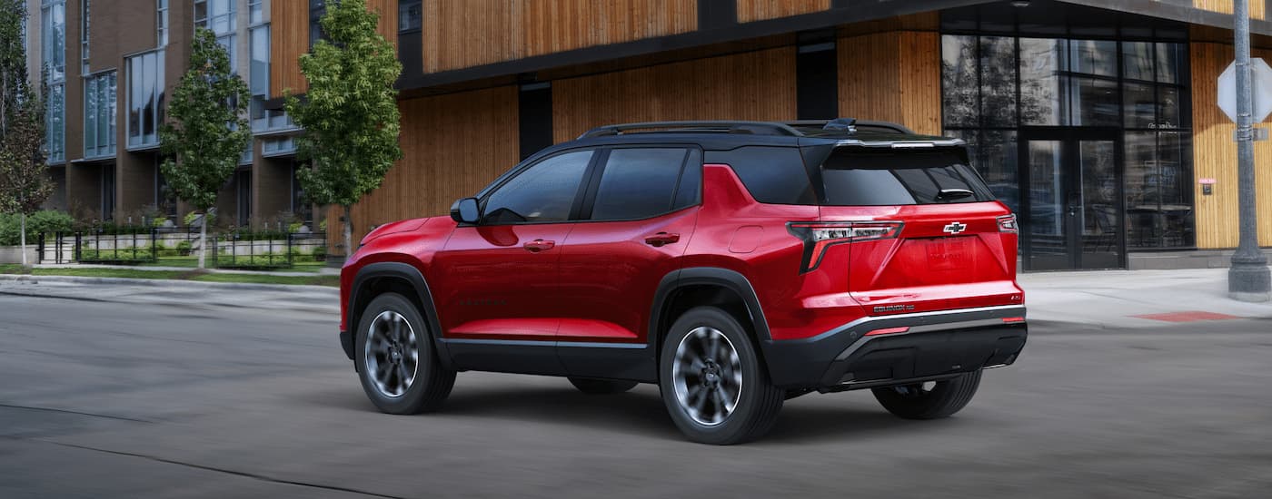 A red 2025 Chevy Equinox RS for sale near Bennington on a test drive.