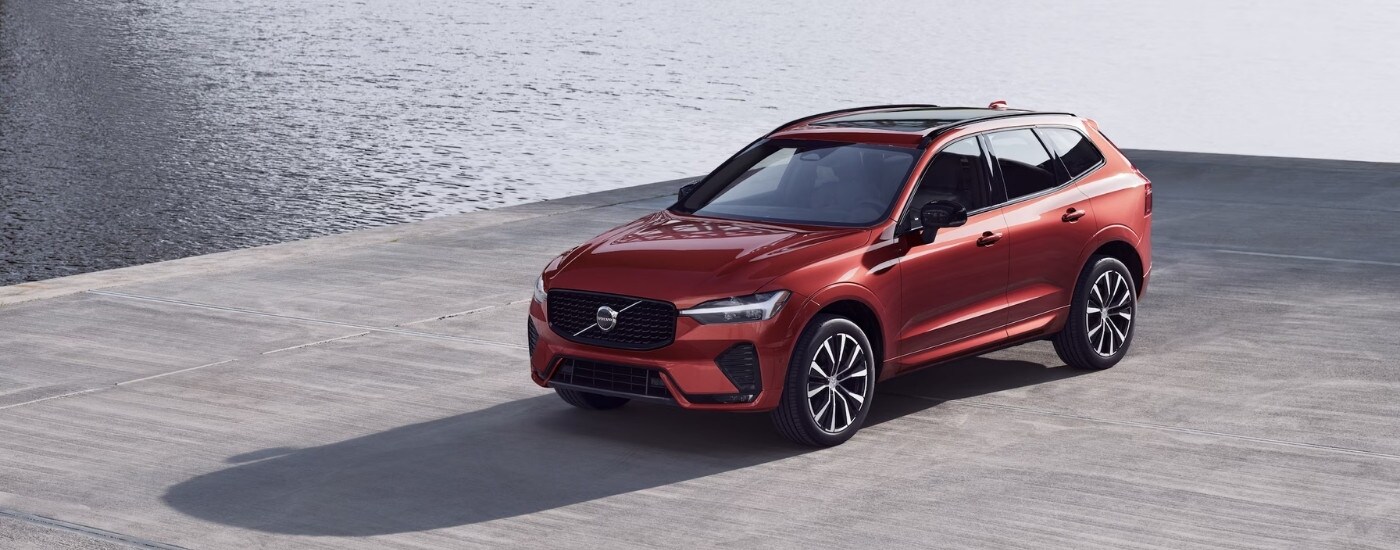 Overhead view of a red 2025 Volvo XC60 parked on a concrete pier.
