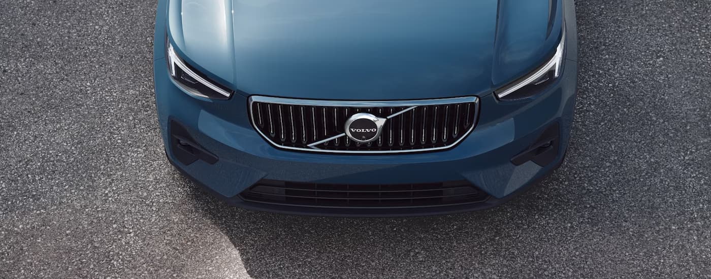 The front and hood of a blue 2025 Volvo XC40 for sale in Cheshire.