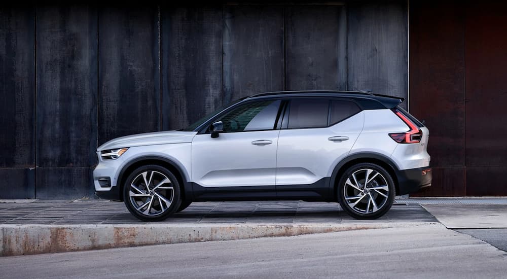 A white 2020 Volvo XC40 parked by a wall.