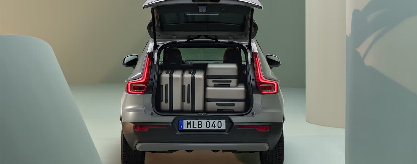 The rear cargo storage capacity of a grey 2025 Volvo XC40.